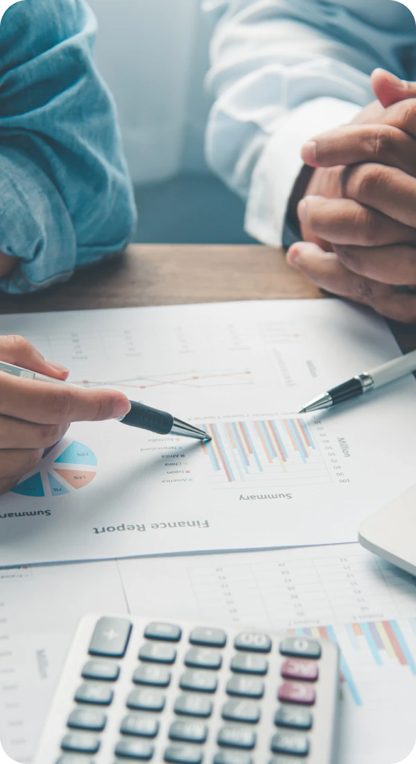 Business meeting with financial charts