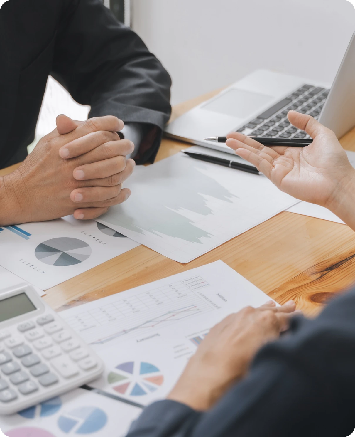 Two people analyzing data at a table