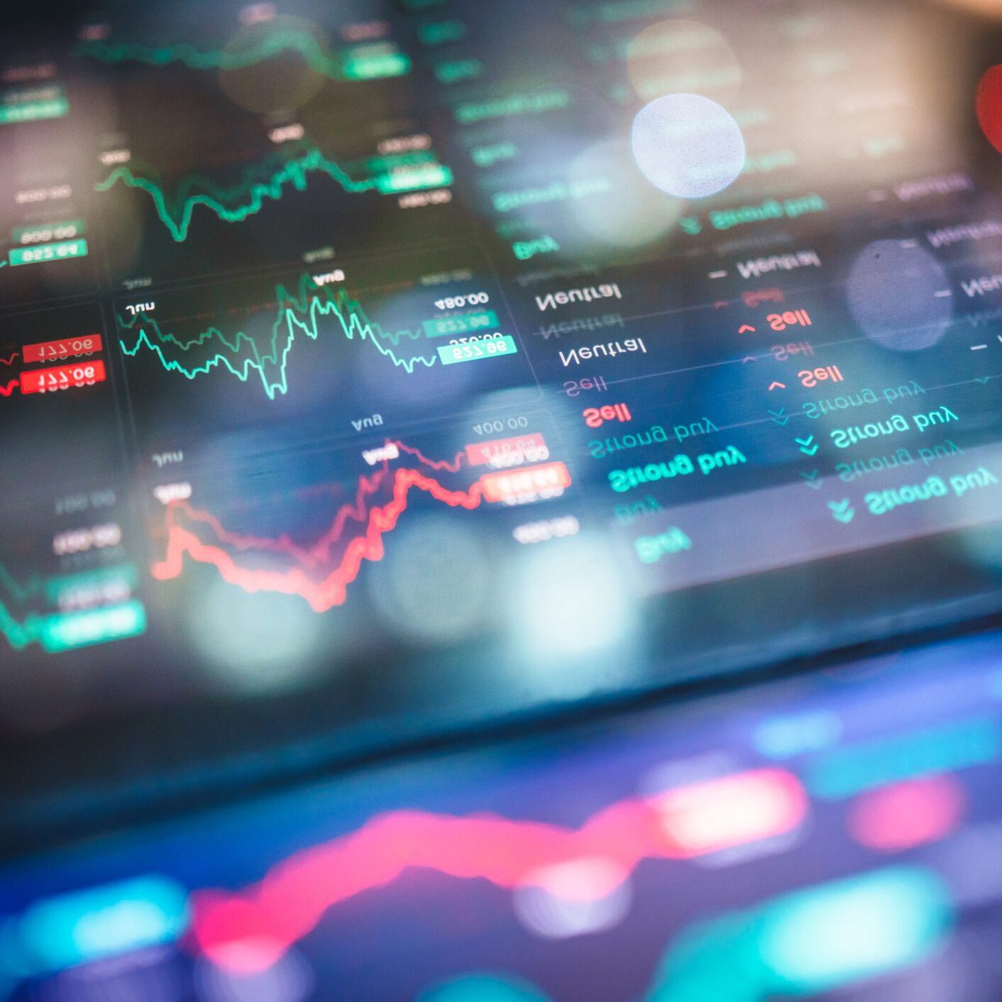 close-up of digital screen with financial charts and graphs showing market fluctuations, used for topics like online investing, trading strategy, portfolio performance, and economic updates