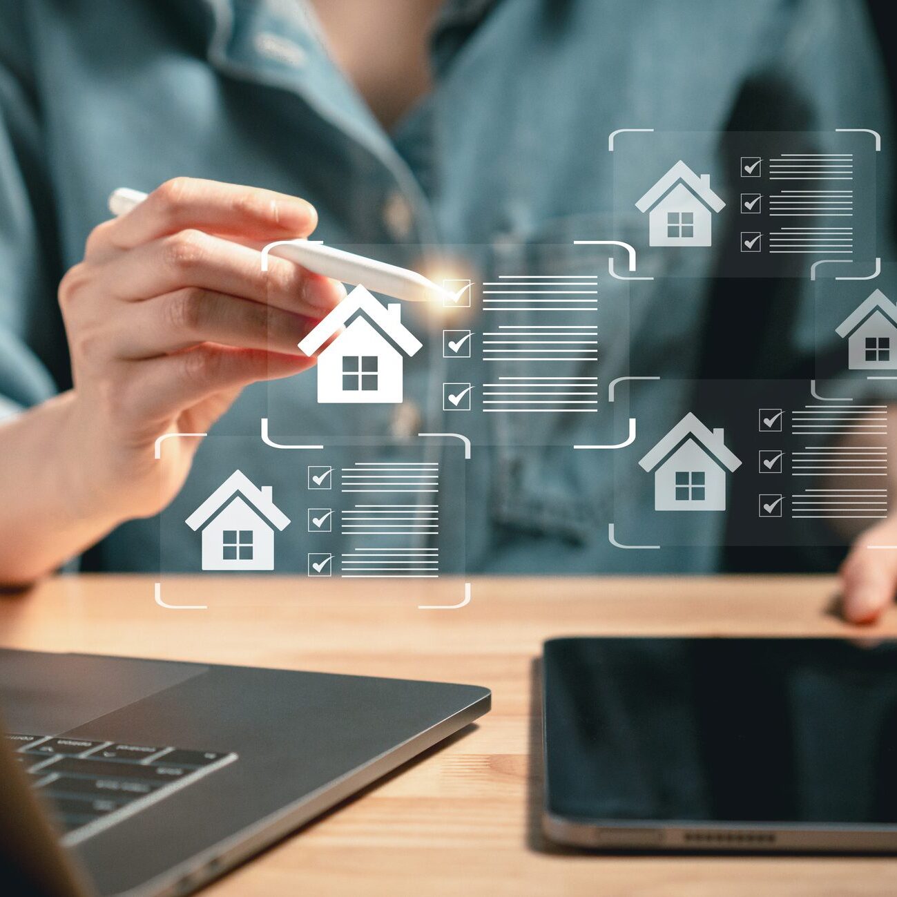Close-up of individual using stylus to interact with virtual housing checklists on screen symbolizing real estate choice and digital property search